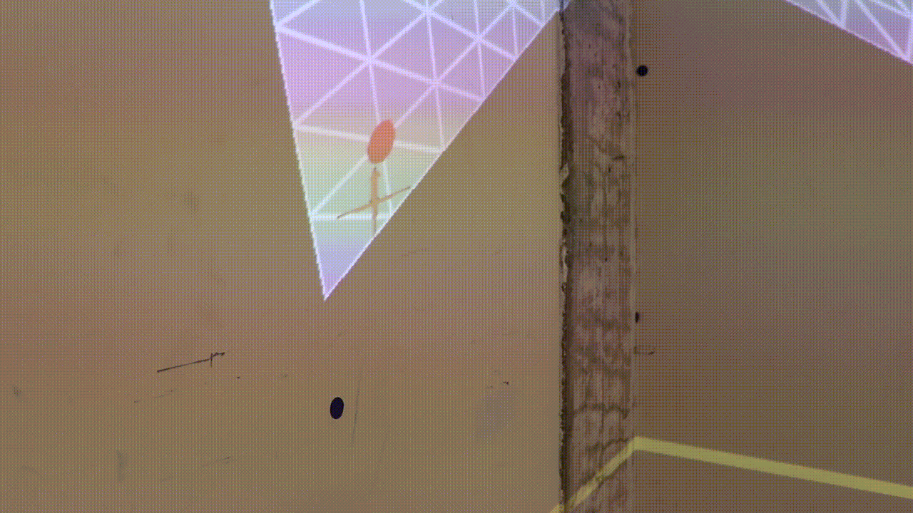 On a close-up of the mesh, a vertex is selected. The corresponding cross is moved to the target location on the wall corner.